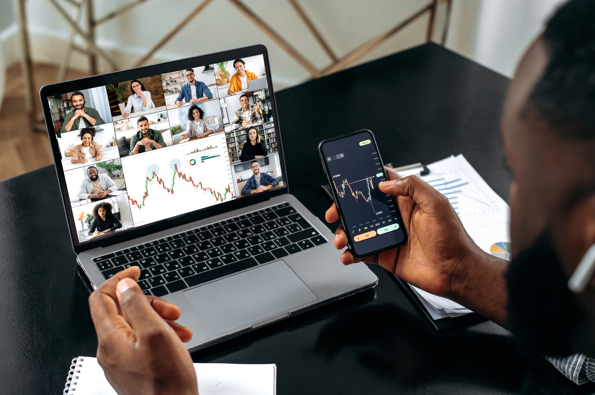 Stock exchange. Successful african american male crypto trader, holding an online video conference with multiracial colleagues, discussing and analyzing the stock market, possible risks, rise and fall